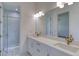 Clean bathroom with double vanity and a walk-in shower at 10 Whitehall Ct, Flagler Beach, FL 32136