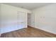 Bright bedroom with hardwood floors and double doors at 10 Whitehall Ct, Flagler Beach, FL 32136