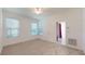 Well-lit bedroom with neutral carpeting and ceiling fan at 211 Drummond Ln, Deland, FL 32724