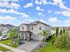 Two-story house with a large driveway and landscaped yard at 137 Azure Mist Way, Daytona Beach, FL 32124