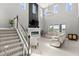 Spacious living room with a modern fireplace and large windows at 137 Azure Mist Way, Daytona Beach, FL 32124