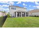 Large backyard with screened patio and grassy area at 137 Azure Mist Way, Daytona Beach, FL 32124