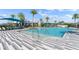 Stunning resort-style pool with lounge chairs and umbrellas at 137 Azure Mist Way, Daytona Beach, FL 32124