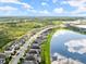 Aerial view of lakefront homes and community at 137 Azure Mist Way, Daytona Beach, FL 32124