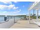 Lakefront community deck with pergola and seating at 137 Azure Mist Way, Daytona Beach, FL 32124