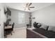 Bright bedroom with a bed, desk, and window at 137 Azure Mist Way, Daytona Beach, FL 32124