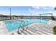 Relaxing community pool with surrounding lounge area at 137 Azure Mist Way, Daytona Beach, FL 32124