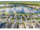 Aerial view of homes and lake with reflection of clouds at 137 Azure Mist Way, Daytona Beach, FL 32124