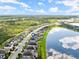 Aerial view of house and neighborhood by the lake at 137 Azure Mist Way, Daytona Beach, FL 32124