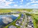 Aerial view of lake and homes in a community at 137 Azure Mist Way, Daytona Beach, FL 32124
