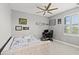 Bedroom featuring a daybed, desk, and window at 137 Azure Mist Way, Daytona Beach, FL 32124