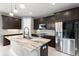 Modern kitchen with stainless steel appliances and granite countertops at 137 Azure Mist Way, Daytona Beach, FL 32124