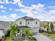 Two-story house with a large driveway and landscaped yard at 137 Azure Mist Way, Daytona Beach, FL 32124