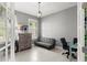 Bright home office features a comfortable sofa and workspace at 137 Azure Mist Way, Daytona Beach, FL 32124