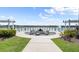 Community lakefront firepit with seating and waterfront views at 137 Azure Mist Way, Daytona Beach, FL 32124