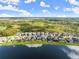 Aerial view of a neighborhood with lakefront homes at 137 Azure Mist Way, Daytona Beach, FL 32124