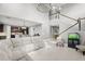 Open concept living room with sectional sofa and stairs at 137 Azure Mist Way, Daytona Beach, FL 32124