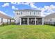 Spacious backyard with screened patio, perfect for outdoor entertaining at 137 Azure Mist Way, Daytona Beach, FL 32124