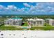 Aerial view of beachfront condo building with pool and ocean access at 4565 S Atlantic Ave # 5308, Port Orange, FL 32127