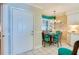 Kitchen features breakfast nook with teal chairs and white cabinets at 4565 S Atlantic Ave # 5308, Port Orange, FL 32127