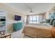 Main bedroom with ocean views, a king-size bed, and teal dresser at 4565 S Atlantic Ave # 5308, Port Orange, FL 32127