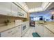 Modern white kitchen featuring stainless steel appliances and ample counter space at 4565 S Atlantic Ave # 5308, Port Orange, FL 32127