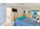 Spacious bedroom with a dresser, TV, and en-suite bathroom at 4565 S Atlantic Ave # 5308, Port Orange, FL 32127