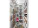 Large walk-in closet with custom shelving and organizers at 89 S Atlantic Ave # 1002, Ormond Beach, FL 32176