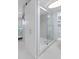 Updated bathroom with gray vanity, white toilet and walk-in shower at 89 S Atlantic Ave # 1002, Ormond Beach, FL 32176