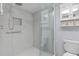 Walk-in shower with marble tile and modern fixtures at 89 S Atlantic Ave # 1002, Ormond Beach, FL 32176