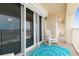 Balcony with rocking chair, ocean view, and teal rug at 89 S Atlantic Ave # 1002, Ormond Beach, FL 32176