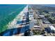 Aerial view of coastline, highlighting building's location near beach at 89 S Atlantic Ave # 1002, Ormond Beach, FL 32176