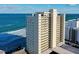 Oceanfront building, balconies, and beach access visible from above at 89 S Atlantic Ave # 1002, Ormond Beach, FL 32176