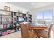 Game Room with a large game table and a wall of books at 89 S Atlantic Ave # 1002, Ormond Beach, FL 32176