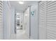 Hallway with barn door and access to bedrooms and bathrooms at 89 S Atlantic Ave # 1002, Ormond Beach, FL 32176