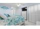 Primary bedroom with white furniture and ocean decor at 89 S Atlantic Ave # 1002, Ormond Beach, FL 32176