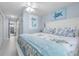 King-size bed in a spacious main bedroom with coastal decor at 89 S Atlantic Ave # 1002, Ormond Beach, FL 32176