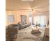 Virtually staged living room with comfortable seating and hardwood floors at 129 Blue Heron Dr # A, Daytona Beach, FL 32119