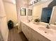 Bathroom with double vanity and a shower at 129 Blue Heron Dr # A, Daytona Beach, FL 32119