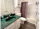Clean bathroom with tub and shower combo, green vanity at 129 Blue Heron Dr # A, Daytona Beach, FL 32119