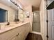 Bathroom with double vanity and a shower at 129 Blue Heron Dr # A, Daytona Beach, FL 32119
