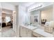 Bright bathroom with double vanity and view of bedroom at 424 Luna Bella Ln # 222, New Smyrna Beach, FL 32168