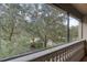 View from balcony showcases lush trees and a park-like setting at 424 Luna Bella Ln # 222, New Smyrna Beach, FL 32168