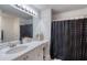 Clean bathroom with shower/tub combo, vanity, and decorative accents at 424 Luna Bella Ln # 222, New Smyrna Beach, FL 32168