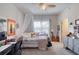 Cozy bedroom with bed, desk, and window at 424 Luna Bella Ln # 222, New Smyrna Beach, FL 32168