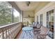 Relaxing screened balcony with wicker furniture and garden at 424 Luna Bella Ln # 222, New Smyrna Beach, FL 32168