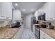 Modern kitchen with stainless steel appliances and granite countertops at 424 Luna Bella Ln # 222, New Smyrna Beach, FL 32168
