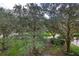 Lush green landscaping with mature trees and walkways at 424 Luna Bella Ln # 222, New Smyrna Beach, FL 32168
