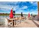 Lakefront patio with tables and chairs, perfect for outdoor dining at 424 Luna Bella Ln # 222, New Smyrna Beach, FL 32168