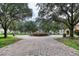Community courtyard with a stone fountain and brick walkways at 424 Luna Bella Ln # 222, New Smyrna Beach, FL 32168